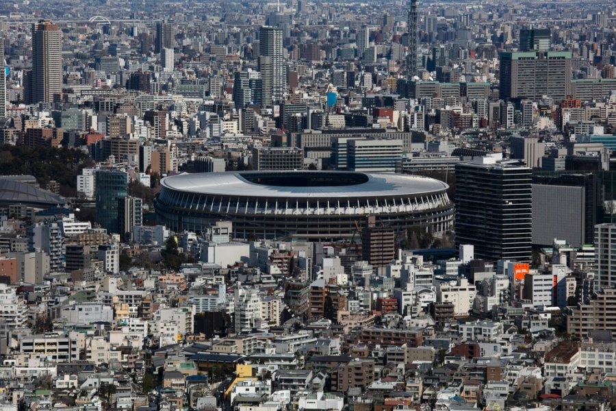 The New National Stadium, a venue for the opening and closing ceremonies at the Tokyo 2020 Olympics, is seen from Shibuya Sky observation deck in Tokyo. The tentacles of cancelling the Tokyo Olympics — or postponing or staging it in empty venues — would reach into every corner of the globe, much like the spreading virus that now imperils the opening ceremony on July 24. (AP Photo/Jae C. Hong, File)