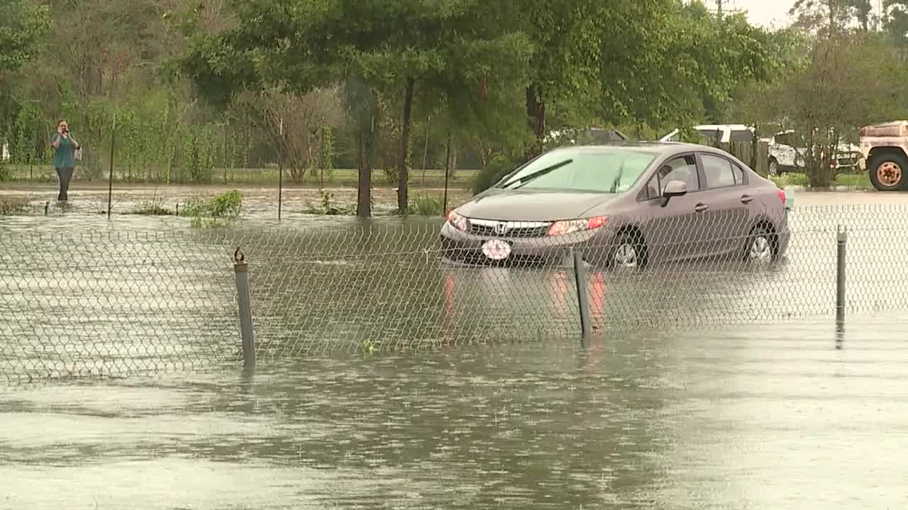 Car stalled in HWY 190 floodwaters