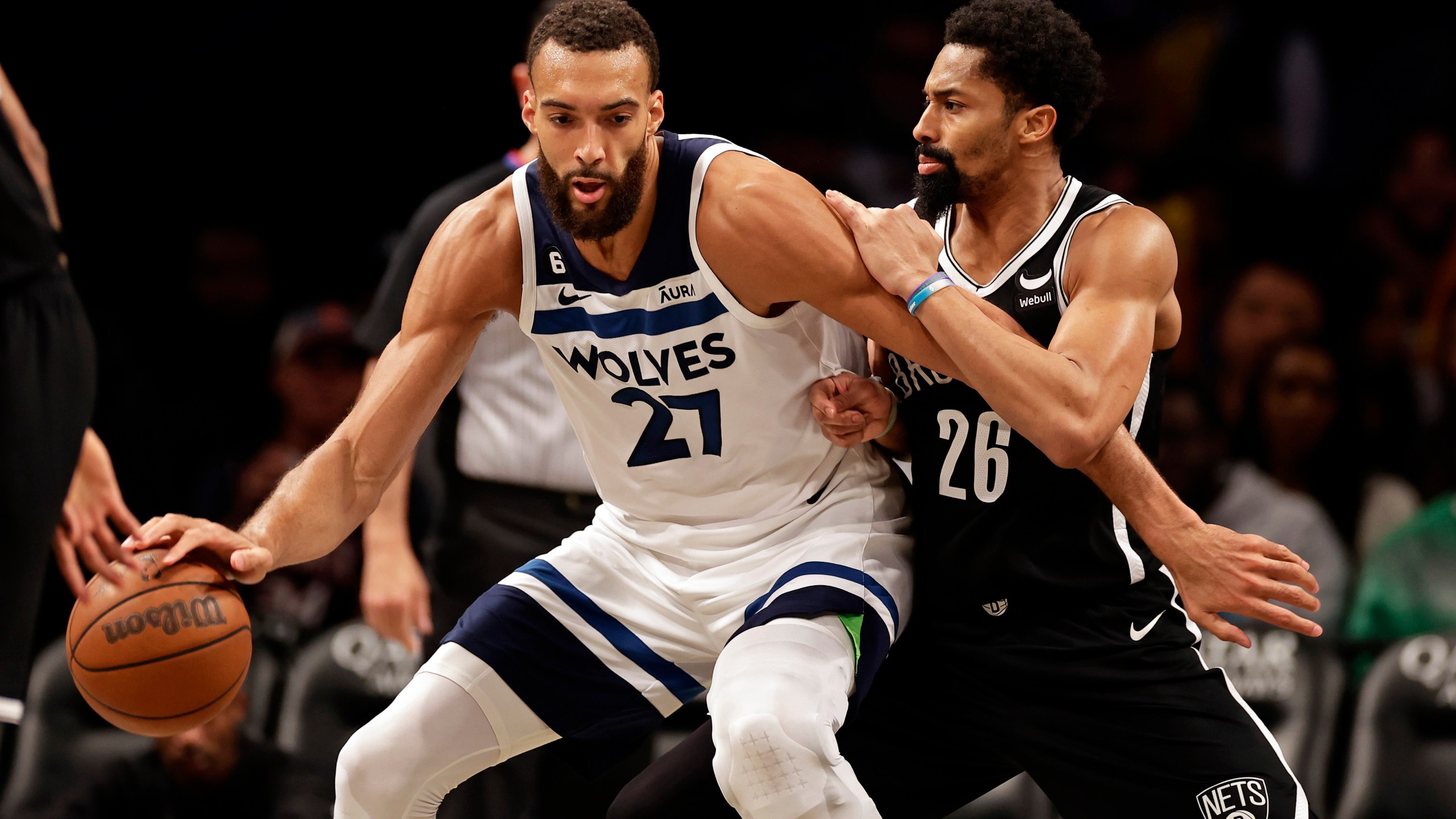 Minnesota Timberwolves center Rudy Gobert (27) drives to the basket against Brooklyn Nets guard Spencer Dinwiddie during the second half of an NBA basketball game, Tuesday, April 4, 2023, in New York. (AP Photo/Adam Hunger)