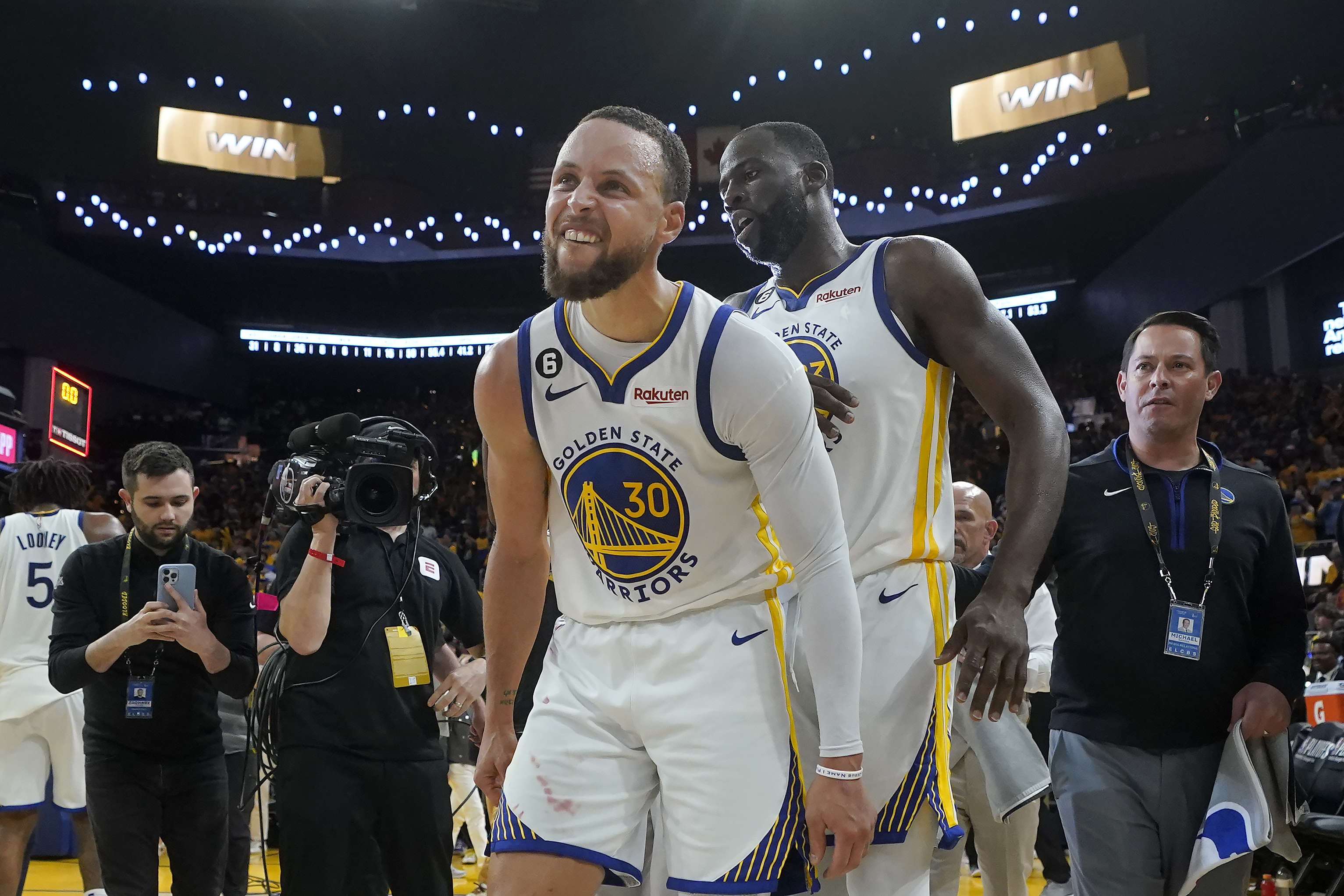 Golden State Warriors guard Stephen Curry (30) celebrates with forward Draymond Green after the Warriors defeated the Sacramento Kings in Game 4 in the first round of the NBA basketball playoffs in San Francisco, Sunday, April 23, 2023. (AP Photo/Jeff Chiu)
