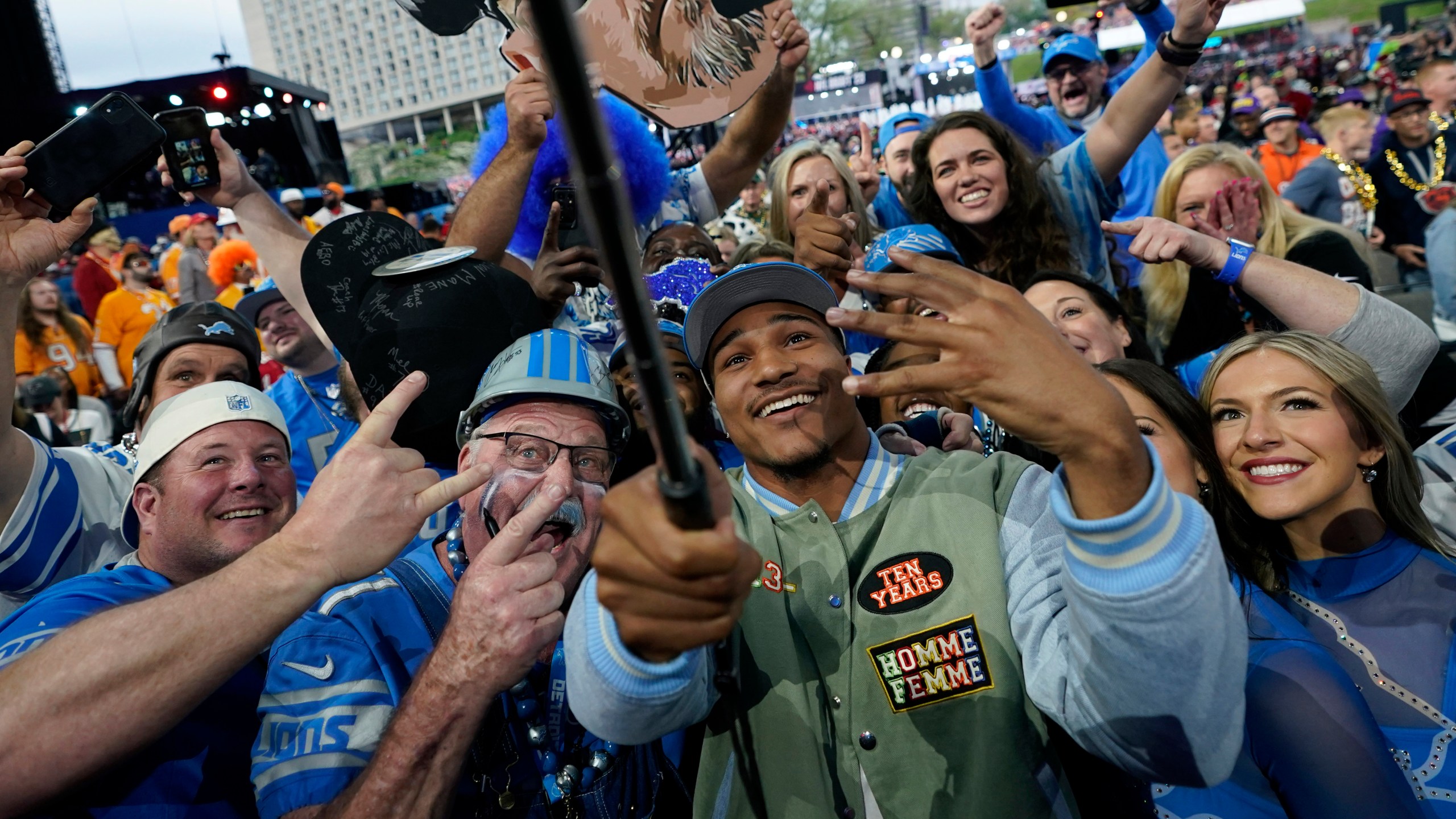 Alabama defensive back Brian Branch takes a selfie with fans after being chosen by the Detroit Lions during the second round of the NFL football draft, Friday, April 28, 2023, in Kansas City, Mo. (AP Photo/Charlie Riedel)