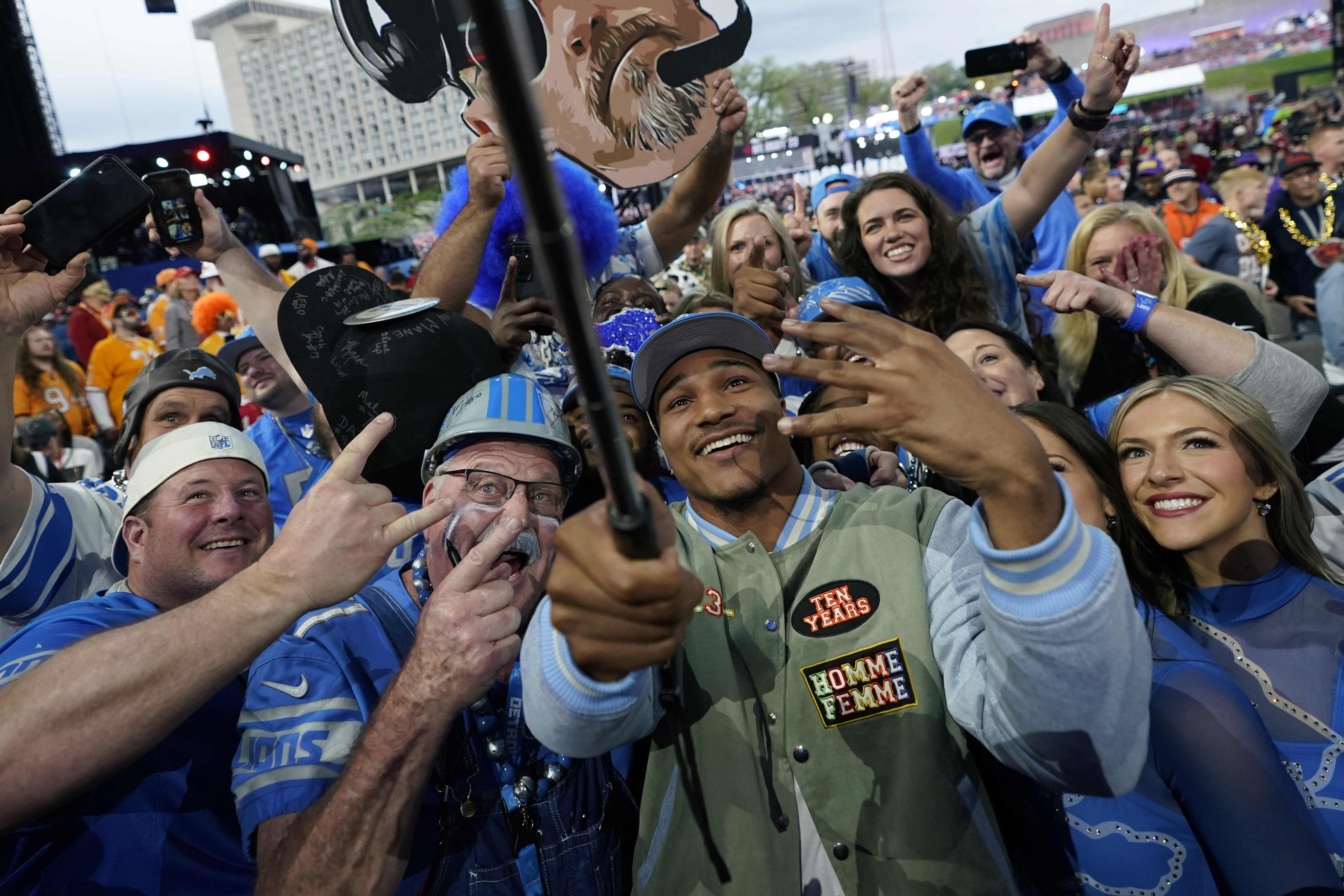 Alabama defensive back Brian Branch takes a selfie with fans after being chosen by the Detroit Lions during the second round of the NFL football draft, Friday, April 28, 2023, in Kansas City, Mo. (AP Photo/Charlie Riedel)