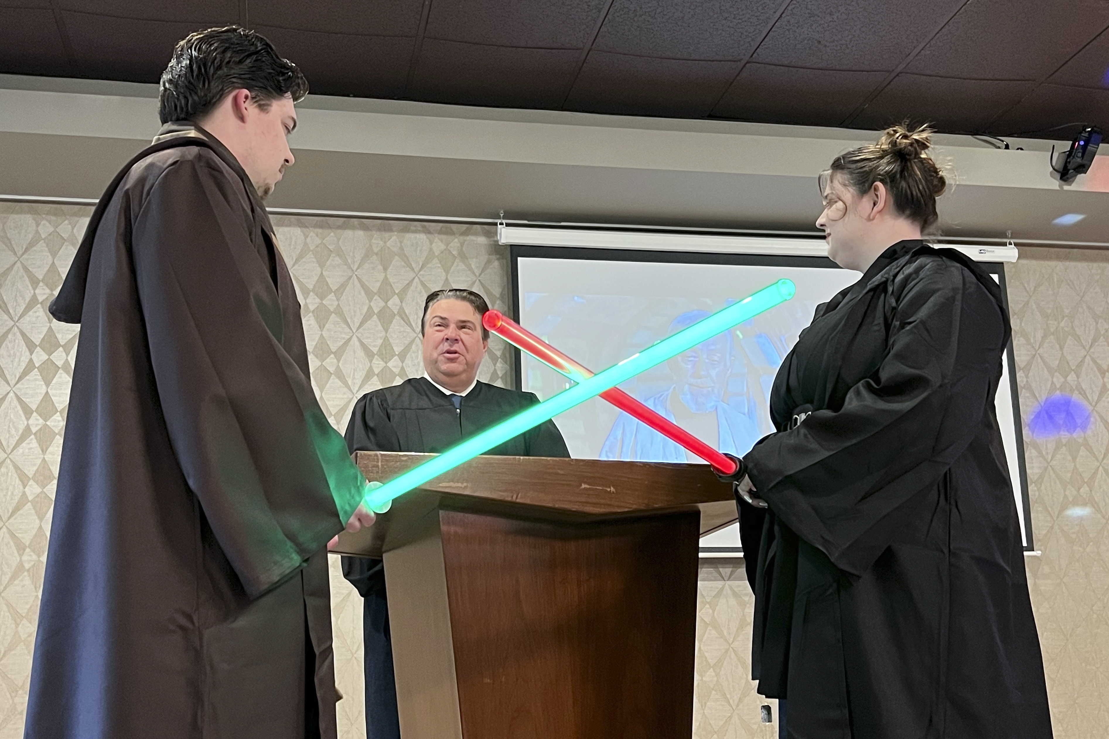 Julia and Robert Jones exchange vows during their wedding ceremony in Akron, Ohio, on Thursday, May 4, 2023. Couples celebrated May the Fourth with a "Star Wars" themed wedding. (AP Photo/Patrick Orsagos)