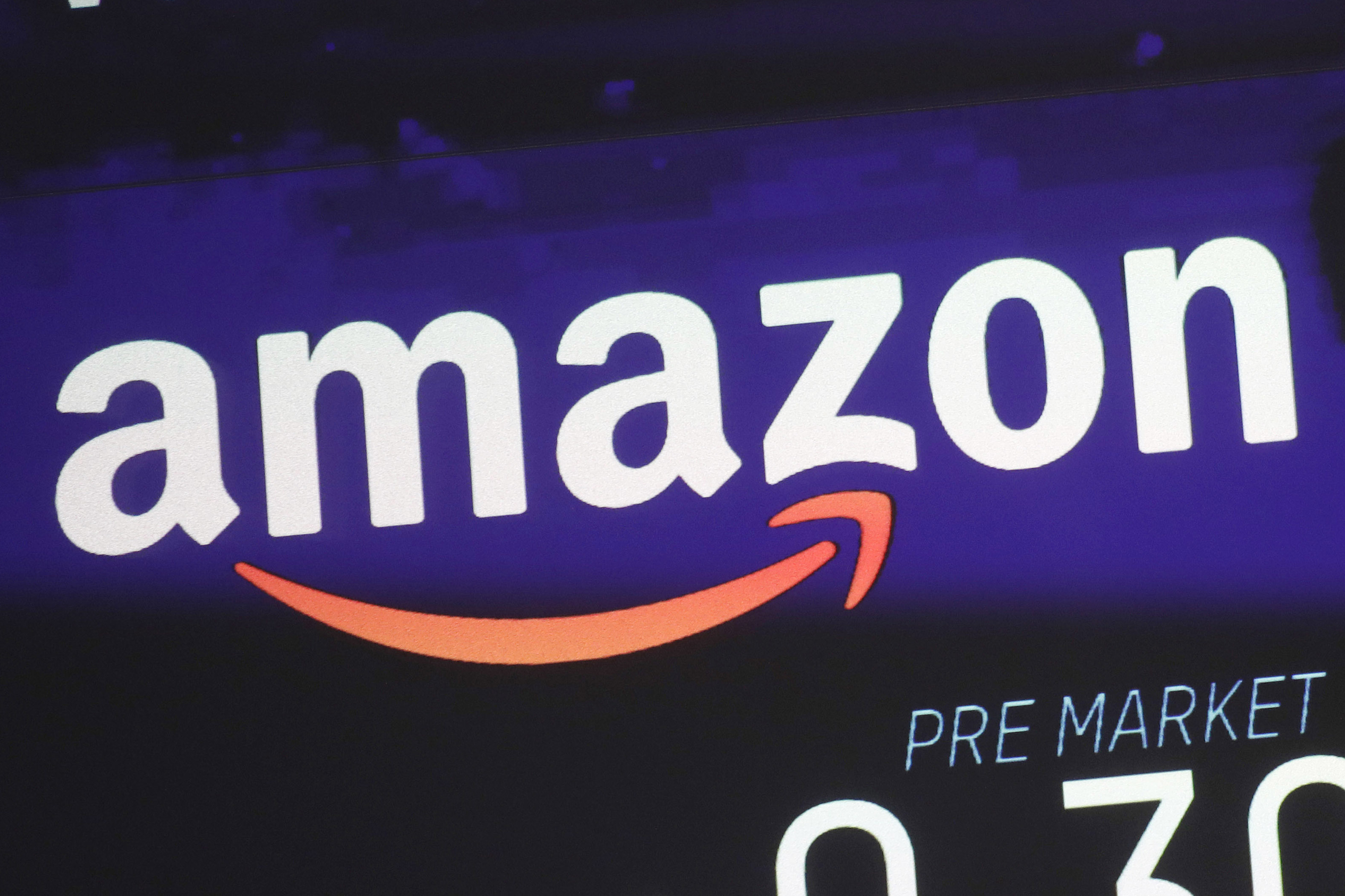 FILE - The price of Amazon stock is shown on a screen at the Nasdaq MarketSite, Wednesday, Dec. 20, 2017, in New York. Amazon reports earnings on Thursday, April 27, 2023. (AP Photo/Mark Lennihan, File)