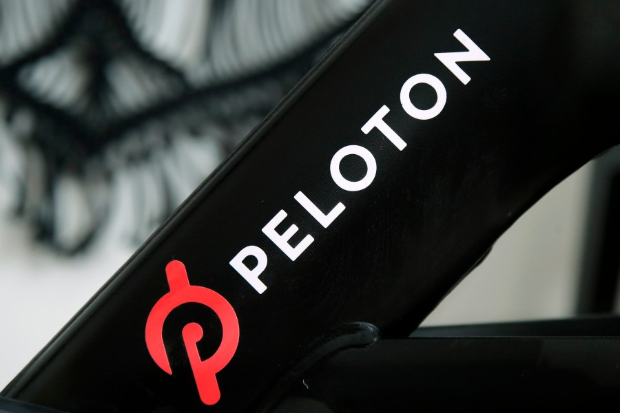 FILE - A Peloton logo is seen on the company's stationary bicycle on Nov. 19, 2019, in San Francisco, Calif. Peloton is recalling more than 2 million of its exercise bikes because the bike’s seat post assembly can break during use, posing fall and injury hazards. (AP Photo/Jeff Chiu, File)