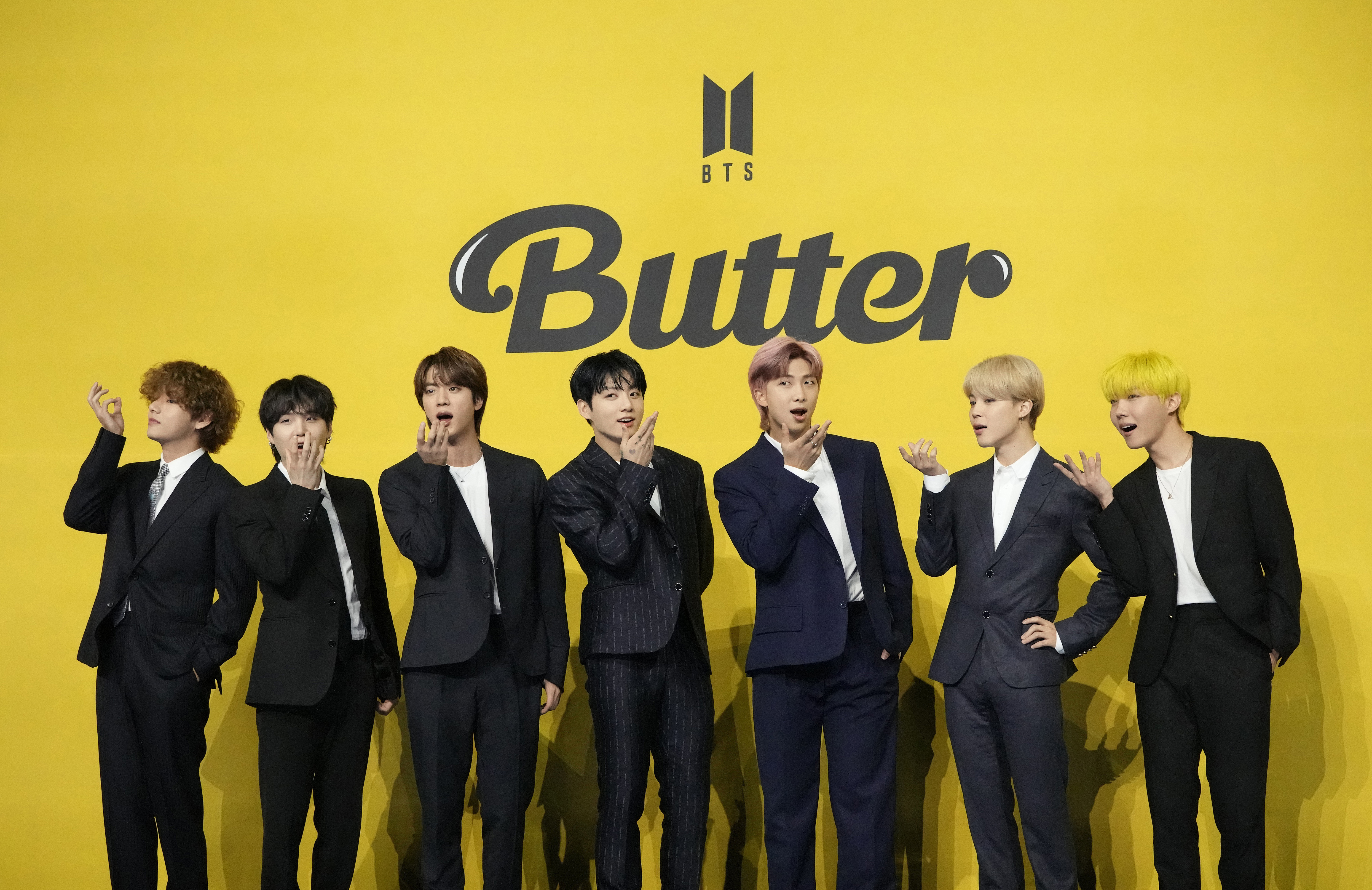 FILE - Members of South Korean K-pop band BTS, V, SUGA, JIN, Jung Kook, RM, Jimin, and j-hope from left to right, pose for photographers ahead of a news conference to introduce their new single "Butter" in Seoul, South Korea, May 21, 2021. The speculation over an untitled book can end, and it is BTS fans, not followers of Taylor Swift, who can rejoice. Flatiron Books announced Thursday, May 11, 2023, the book “4C Untitled Flatiron Nonfiction Summer 2023” was in fact about the mega-popular South Korean boy band, not Swift. (AP Photo/Lee Jin-man, File)