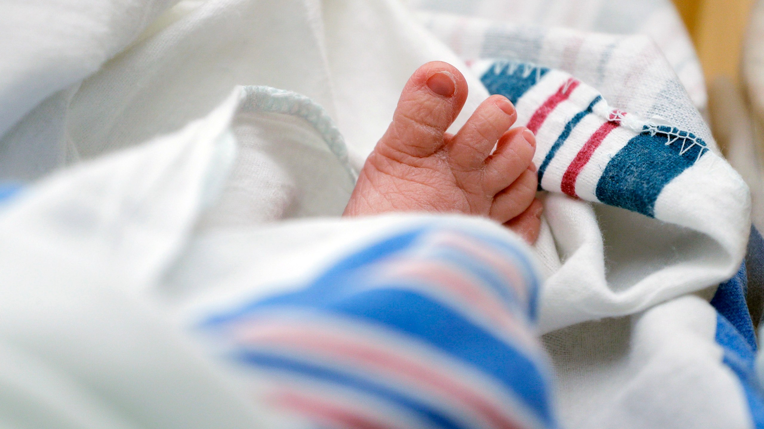 FILE - The toes of a baby are seen DHR Health, July 29, 2020, in McAllen, Texas. Dutton and Wrenlee are on the rise but they’re no match for champs Liam and Olivia as the top baby names in the U.S. last year. (AP Photo/Eric Gay, File)