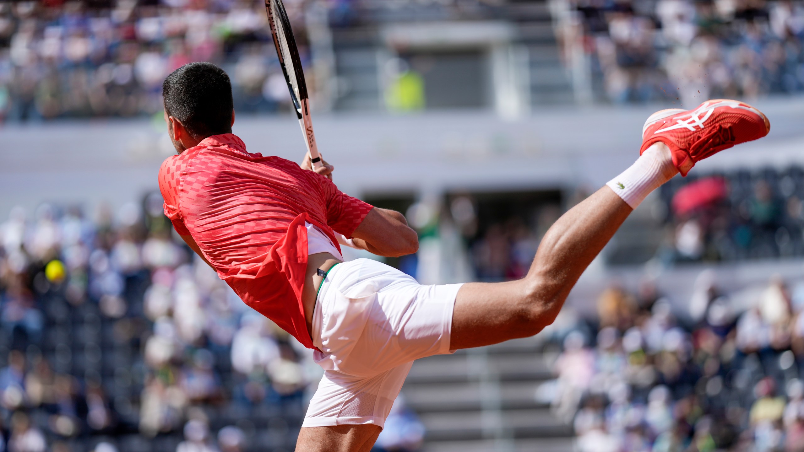 Novak Djocovic returns the ball to Grigor Dimitrov at the Italian Open tennis tournament, in Rome, Sunday, May 14, 2023. (AP Photo/Andrew Medichini)