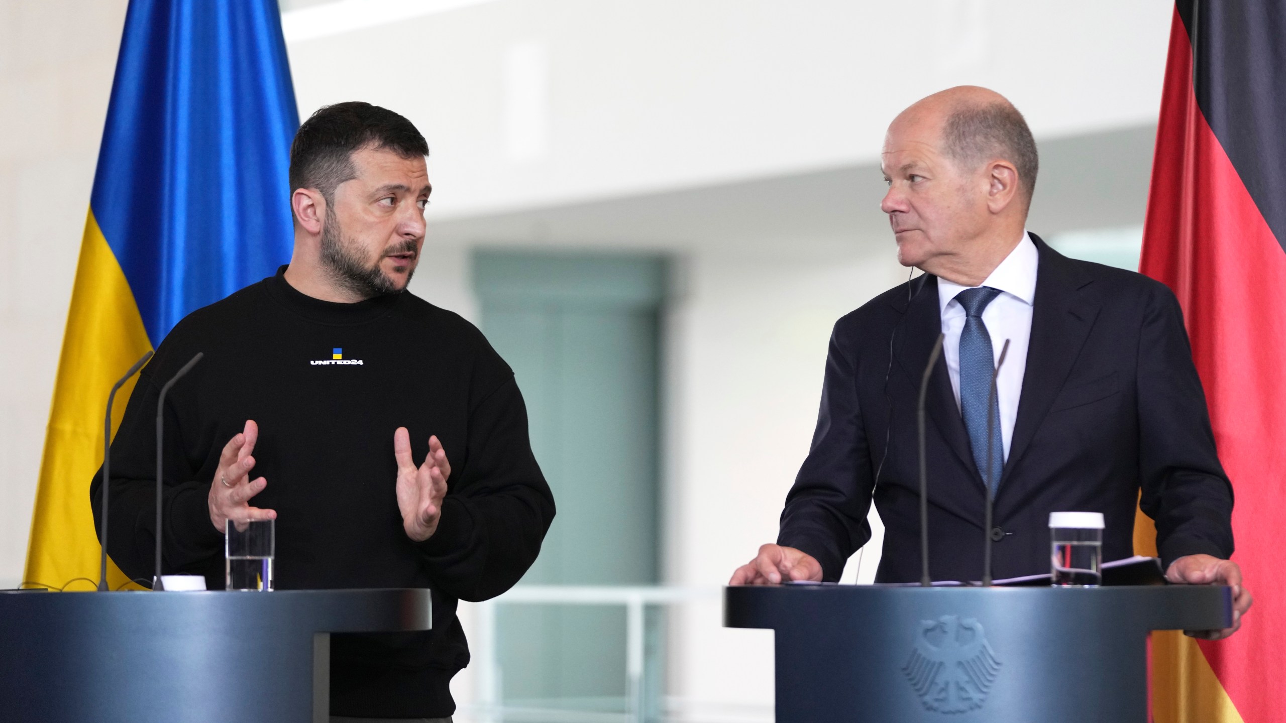 Germany's Chancellor Olaf Scholz, rigth, and Ukraine's President Volodymyr Zelenskyy address a media conference at the chancellery in Berlin, Germany, Sunday, May 14, 2023. Ukrainian President Volodymyr Zelenskyy arrived in Berlin early Sunday for talks with German leaders about further arms deliveries to help his country fend off the Russian invasion and rebuild what's been destroyed by more than a year of devastating conflict. (AP Photo/Matthias Schrader)