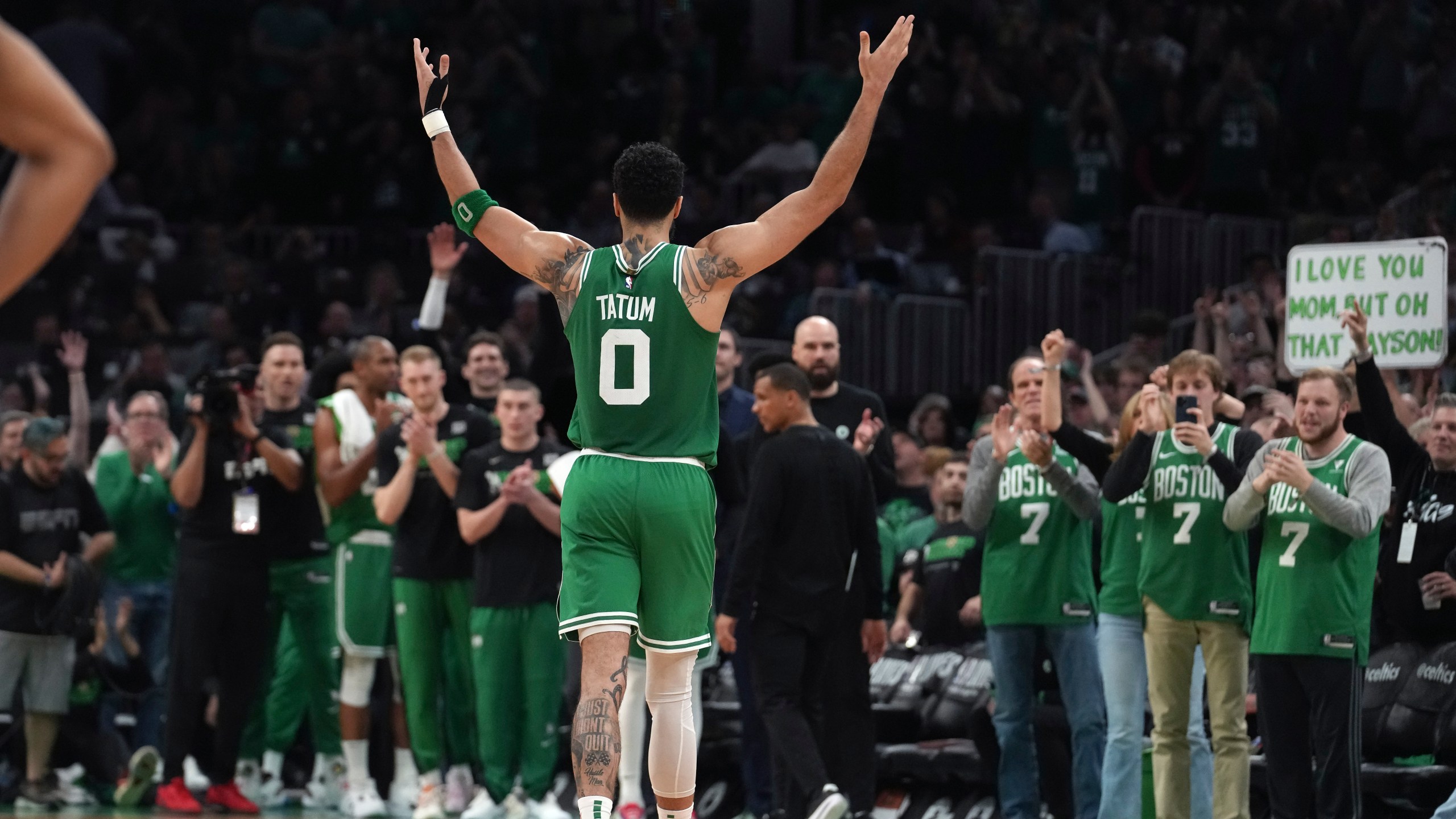 Boston Celtics forward Jayson Tatum (0) receives applause as he steps off the court near the end of Game 7 against the Philadelphia 76ers in the NBA basketball Eastern Conference semifinal playoff series, Sunday, May 14, 2023, in Boston. (AP Photo/Steven Senne)