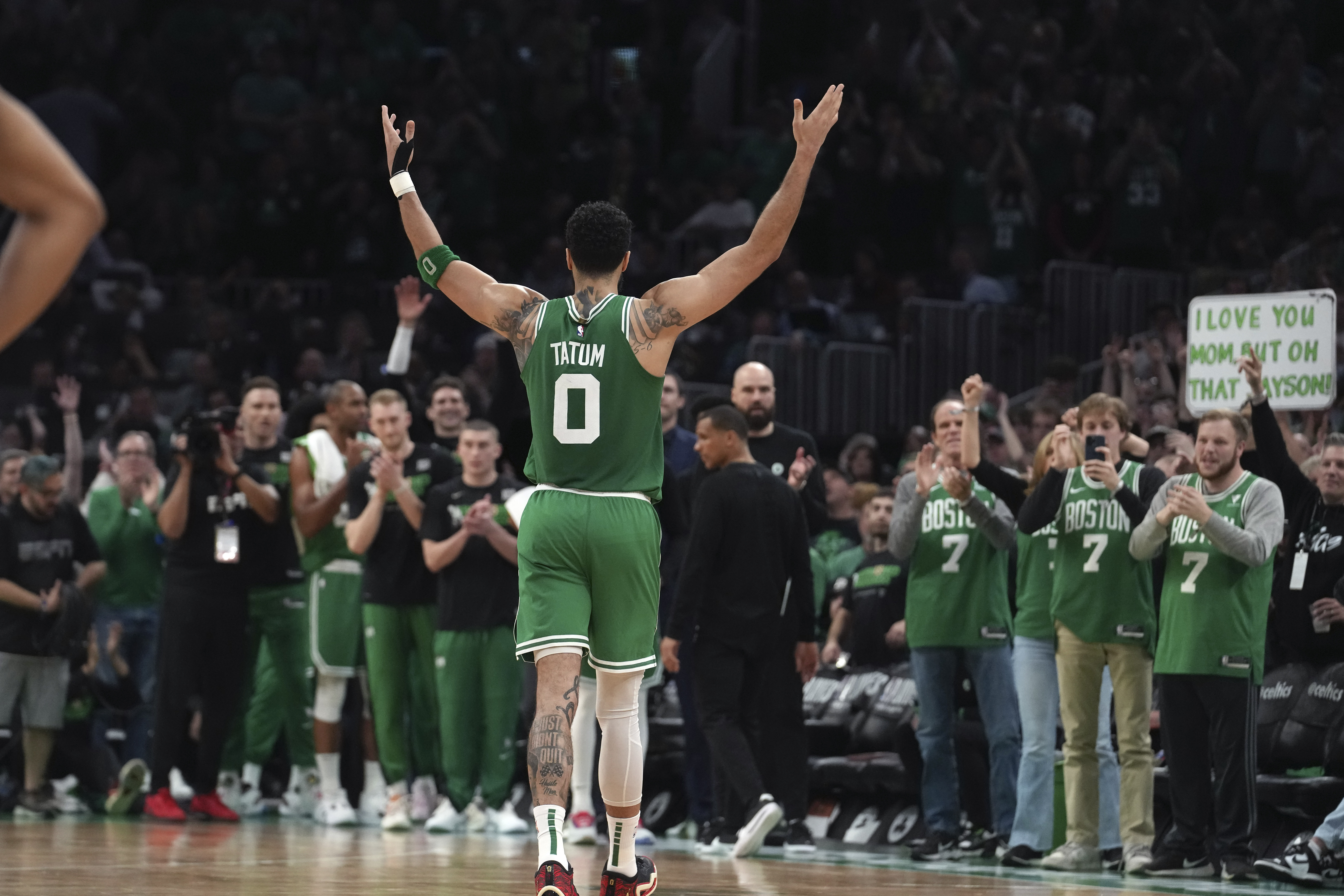 Boston Celtics forward Jayson Tatum (0) receives applause as he steps off the court near the end of Game 7 against the Philadelphia 76ers in the NBA basketball Eastern Conference semifinal playoff series, Sunday, May 14, 2023, in Boston. (AP Photo/Steven Senne)