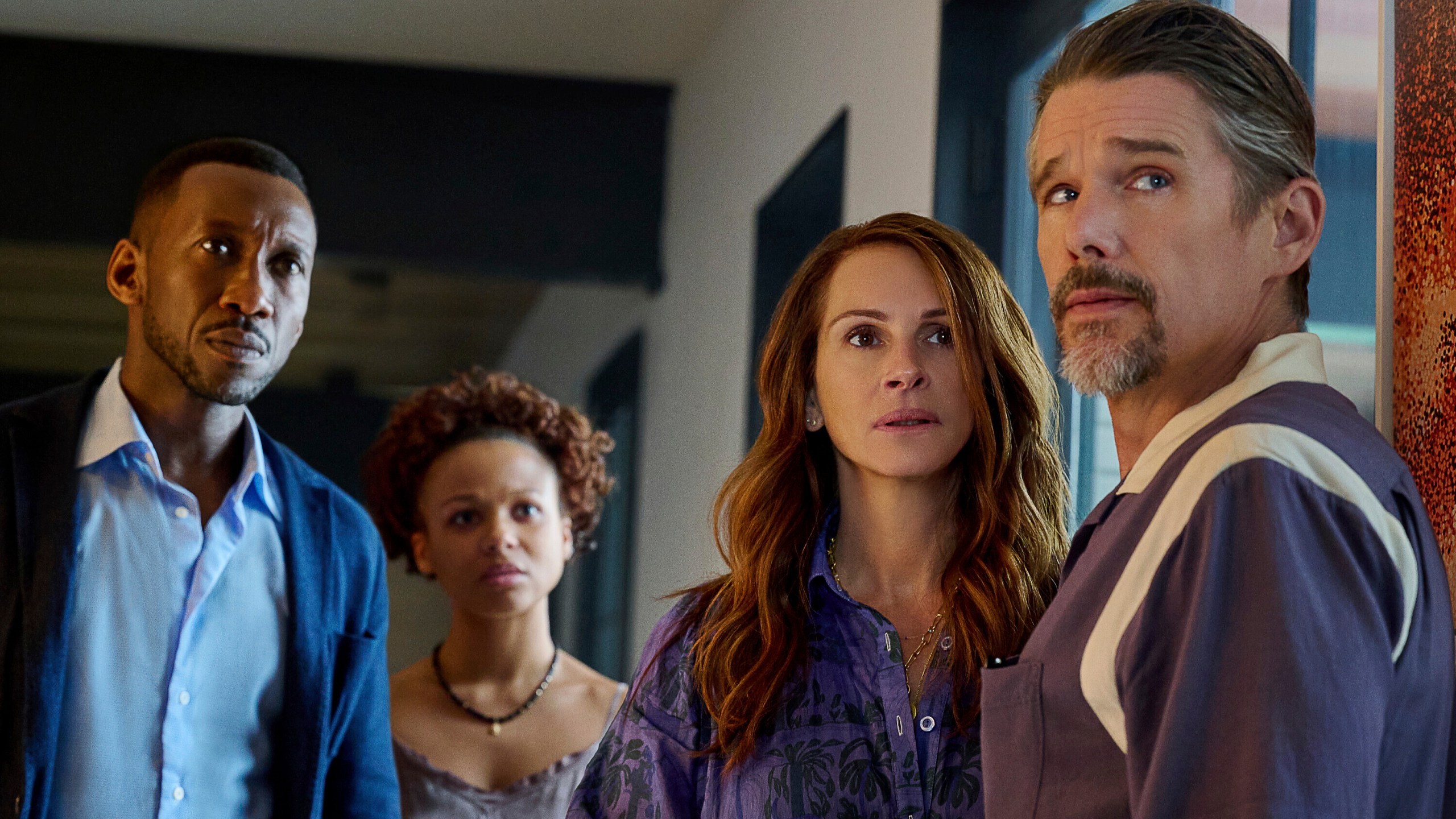 This image released by Netflix shows Mahershela Ali from left, Myha'la Herrold, Julia Roberts and Ethan Hawke in a scene from "Leave the World Behind." (JoJo Whilden/Netflix via AP)