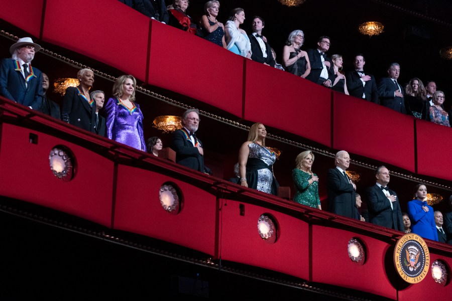 President Joe Biden, first lady Jill Biden, Doug Emhoff, the spouse of Vice President Kamala Harris, together with 2023 Kennedy Center Honorees, from left, British singer and member of the Bee Gees, Barry Gibb; singer Dionne Warwick, soprano Renée Fleming, actor and comedian Billy Crystal and singer and actress Queen Latifah, attend the 46th Kennedy Center Honors at the John F. Kennedy Center for the Performing Arts in Washington, Sunday, Dec. 3, 2023. (AP Photo/Manuel Balce Ceneta)