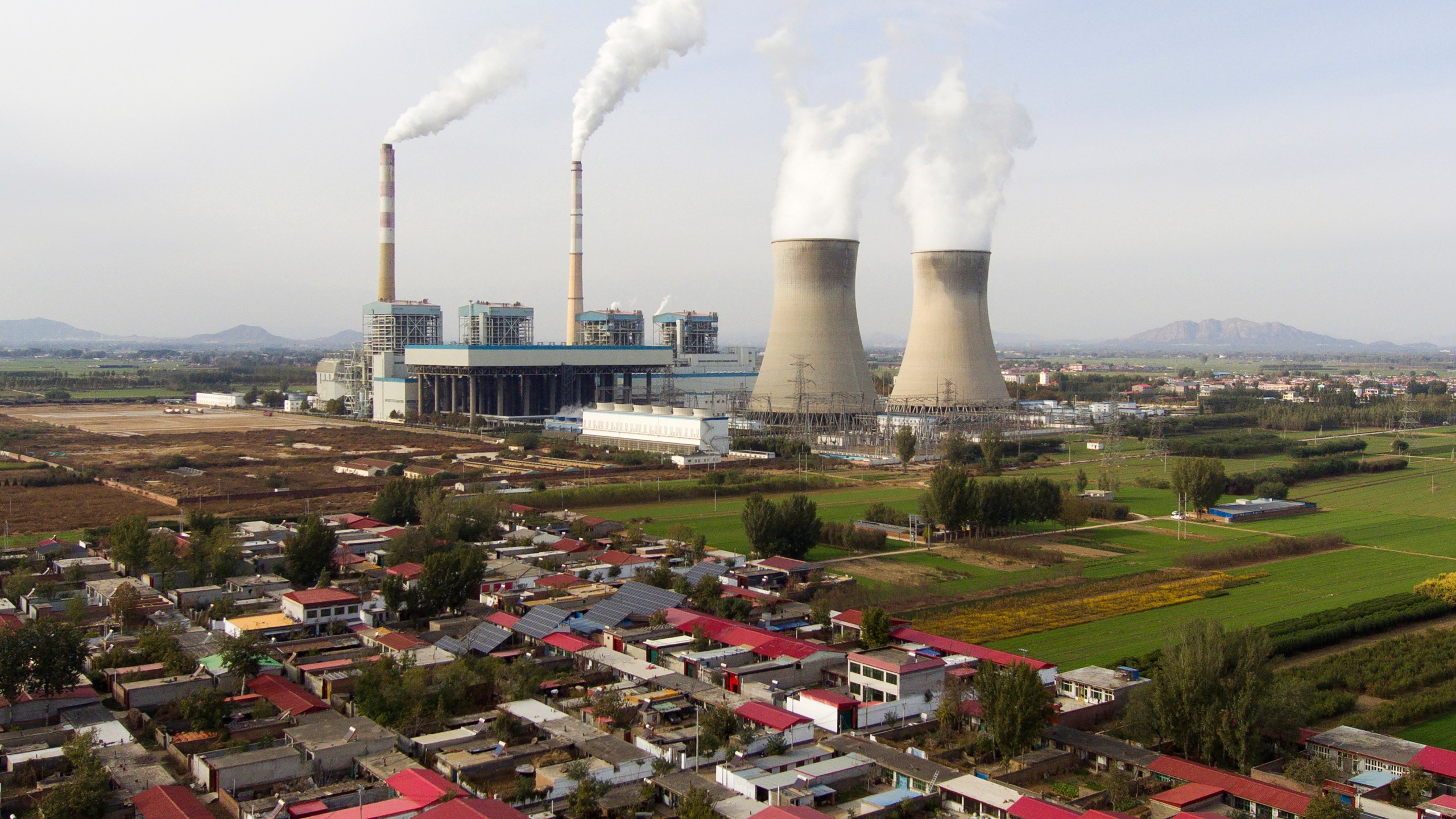 Guohua Power Station, a coal-fired power plant, operates in Dingzhou, Baoding, in the northern China's Hebei province, Friday, Nov. 10, 2023. (AP Photo/Ng Han Guan)