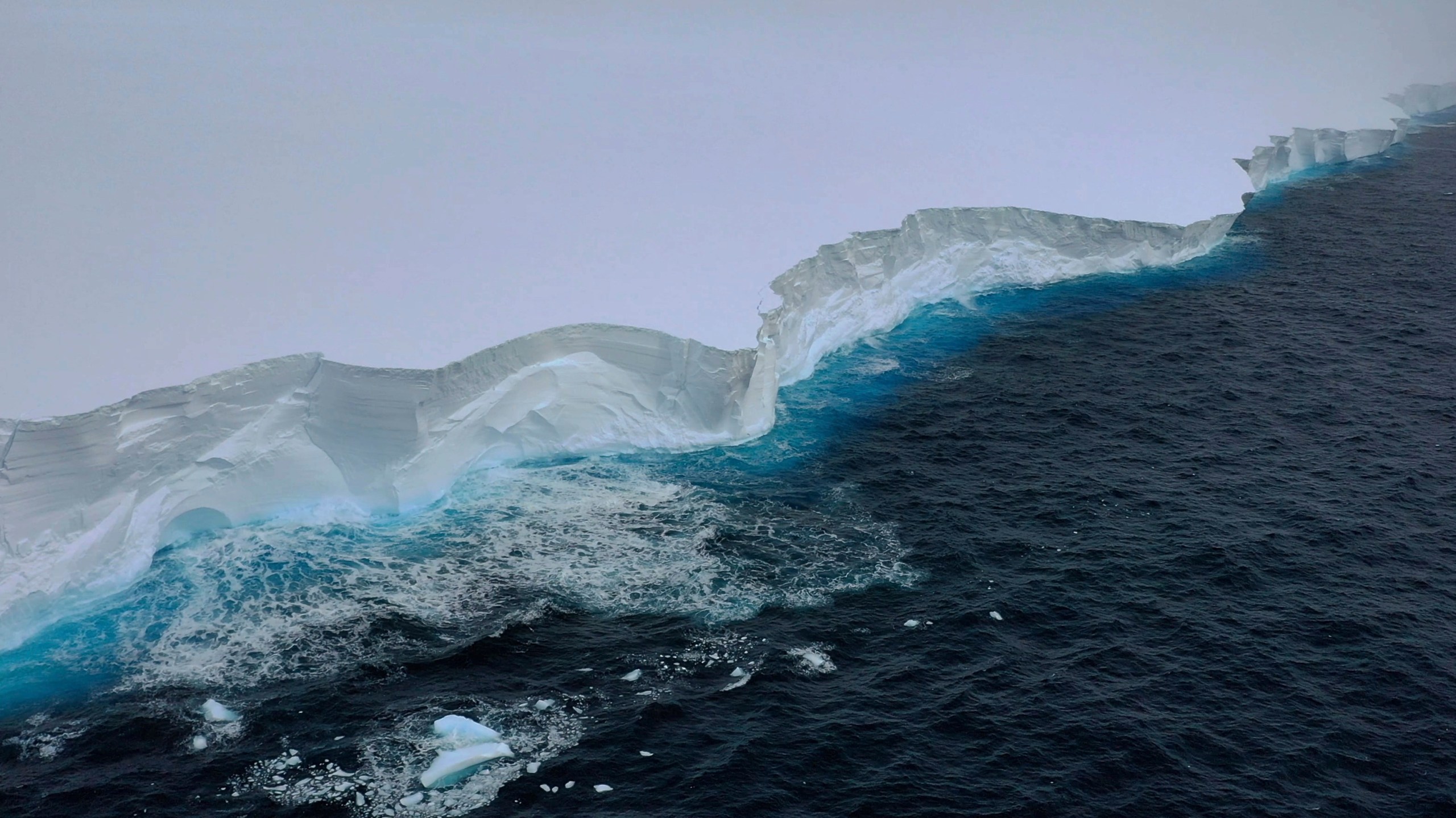 In this handout photo provided by the British Antarctic Survey, a view of the A23a iceberg is seen from the RRS Sir David Attenborough, Antarctica, Friday, Dec. 1, 2023. Britain's polar research ship has crossed paths with the largest iceberg in the world in a “lucky” encounter that enabled scientists to collect seawater samples around the colossal berg as it drifts out of Antarctic waters. The British Antarctic Survey said Monday, Dec. 4 that the RRS Sir David Attenborough passed the mega iceberg, known as the A23a, on Friday near the tip of the Antarctic Peninsula. (T. Gossman, M. Gascoyne, C. Grey/British Antarctic Survey via AP)