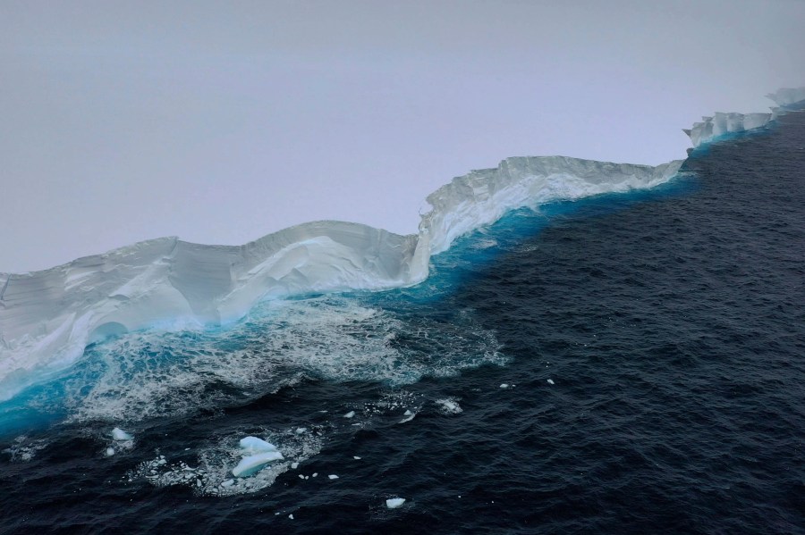 In this handout photo provided by the British Antarctic Survey, a view of the A23a iceberg is seen from the RRS Sir David Attenborough, Antarctica, Friday, Dec. 1, 2023. Britain's polar research ship has crossed paths with the largest iceberg in the world in a “lucky” encounter that enabled scientists to collect seawater samples around the colossal berg as it drifts out of Antarctic waters. The British Antarctic Survey said Monday, Dec. 4 that the RRS Sir David Attenborough passed the mega iceberg, known as the A23a, on Friday near the tip of the Antarctic Peninsula. (T. Gossman, M. Gascoyne, C. Grey/British Antarctic Survey via AP)