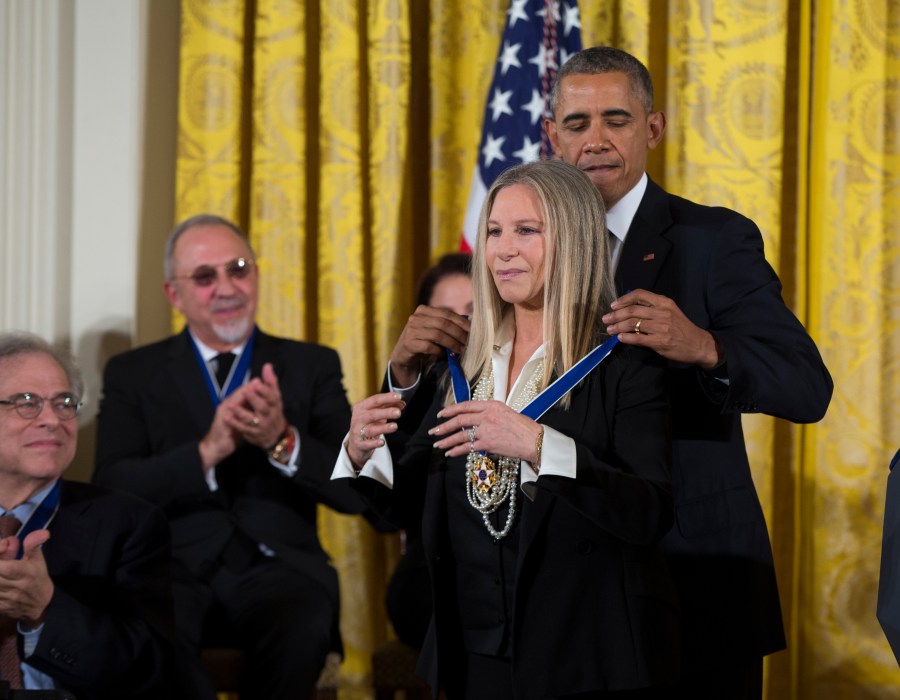 FILE - President Barack Obama, right, presents the Presidential Medal of Freedom to Barbra Streisand during a ceremony in the East Room of the White House, on Tuesday, Nov. 24, 2015, in Washington. Published in early November, “My Name is Barbra” is a nearly 1,000 page memoir that covers one of the epic narratives in modern show business — her uncompromising rise from working class Brooklyn in the 1940s and '50s to global fame. (AP Photo/Evan Vucci, File)