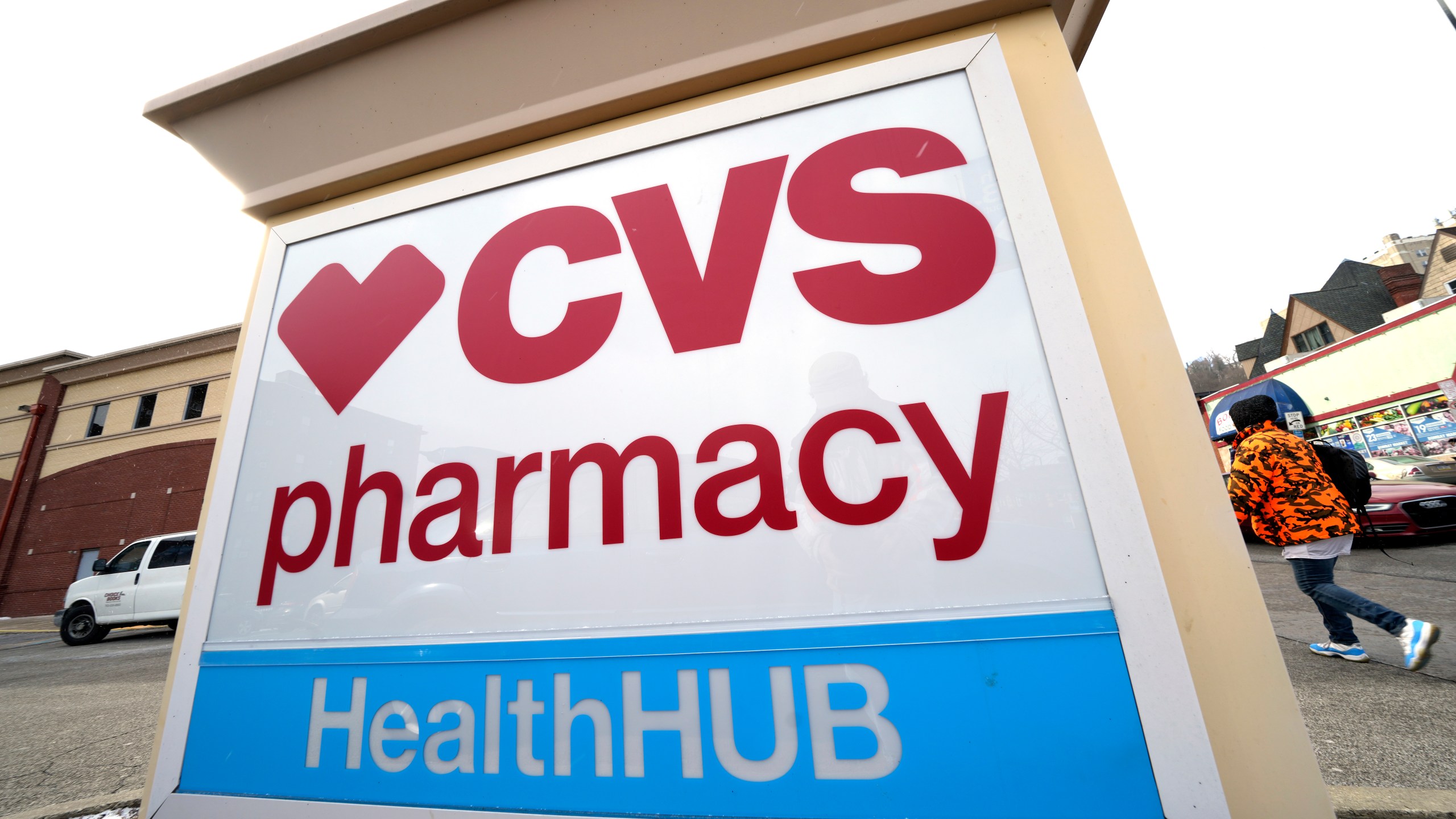 FILE - A CVS store sign is displayed in Pittsburgh on Feb. 3, 2023. CVS Health is introducing changes to how its prescription drug pricing model works, and that could lead to some savings for customers starting next year. The health care giant said Tuesday, Dec. 5, 2023 that it will role out a new reimbursement model designed to make costs more predictable at the drugstore counter. (AP Photo/Gene J. Puskar, File)