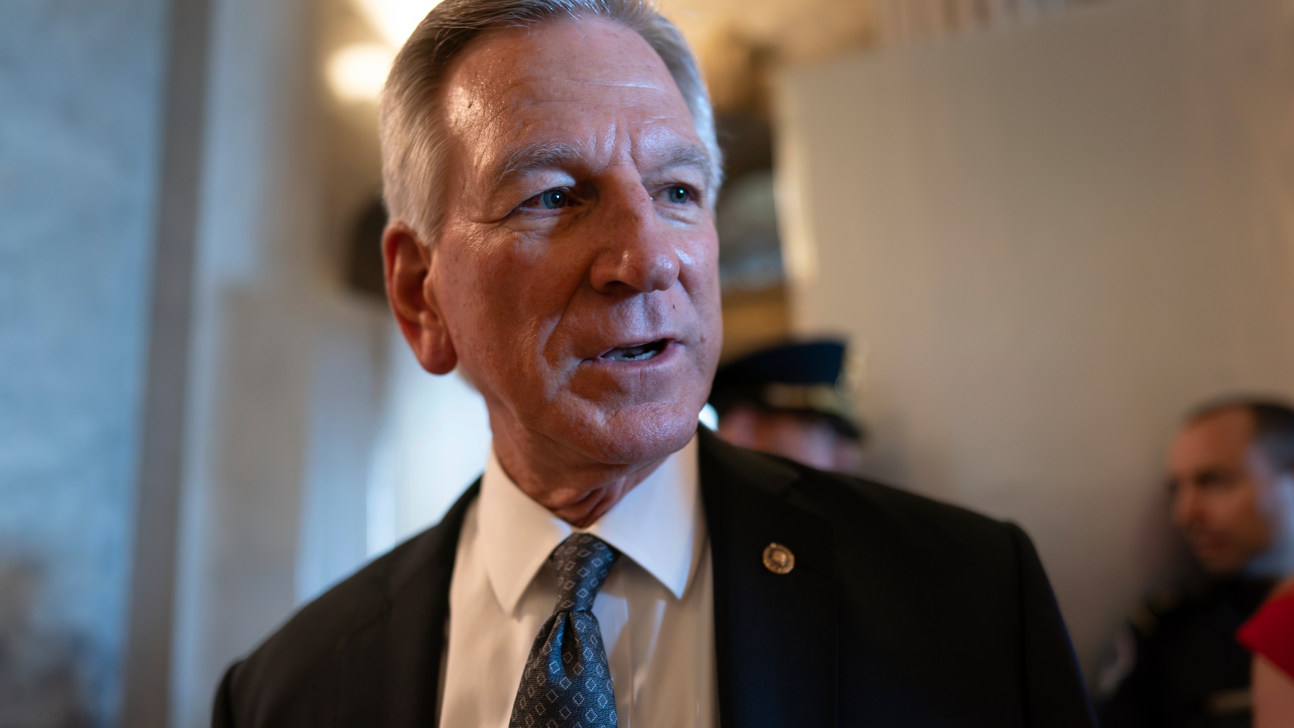 FILE - Sen. Tommy Tuberville, R-Ala., a member of the Senate Armed Services Committee, talks to reporters as he and other senators arrive at the chamber for votes, at the Capitol in Washington, Wednesday, Sept. 6, 2023. Tuberville announced on Tuesday, Dec. 5, that he’s ending his blockade of hundreds of military promotions, following heavy criticism from many of his colleagues in the Senate and clearing the way for hundreds to be approved. (AP Photo/J. Scott Applewhite, File)