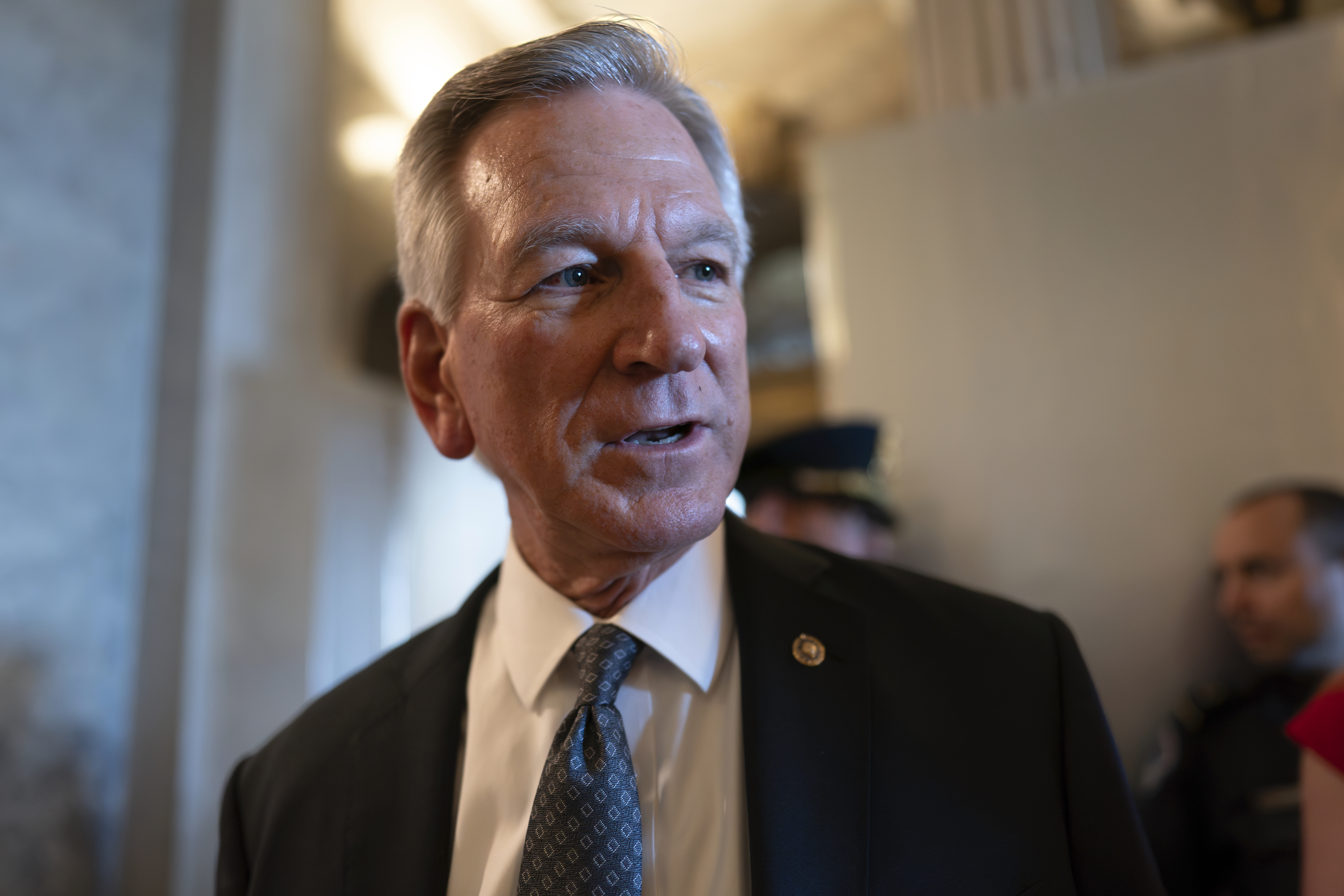 FILE - Sen. Tommy Tuberville, R-Ala., a member of the Senate Armed Services Committee, talks to reporters as he and other senators arrive at the chamber for votes, at the Capitol in Washington, Wednesday, Sept. 6, 2023. Tuberville announced on Tuesday, Dec. 5, that he’s ending his blockade of hundreds of military promotions, following heavy criticism from many of his colleagues in the Senate and clearing the way for hundreds to be approved. (AP Photo/J. Scott Applewhite, File)