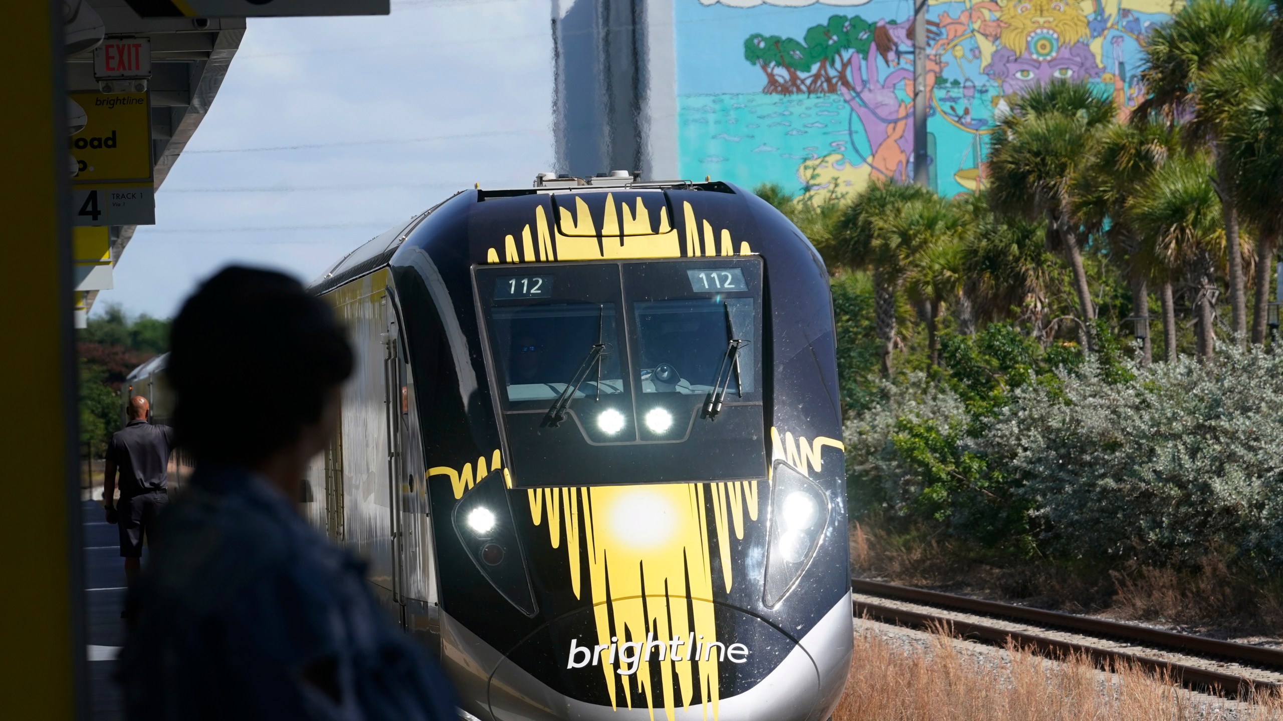 FILE - A Brightline train approaches the Fort Lauderdale station on Sept. 8, 2023, in Fort Lauderdale, Fla. A high-speed rail line between Las Vegas and the Los Angeles area is getting a Biden administration pledge of $3 billion to help start laying track. Nevada's two Democratic U.S. senators said Tuesday, Dec. 5, 2023 the $12 billion project led by Brightline West has all required right-of-way, environmental and labor approvals. (AP Photo/Marta Lavandier, file)