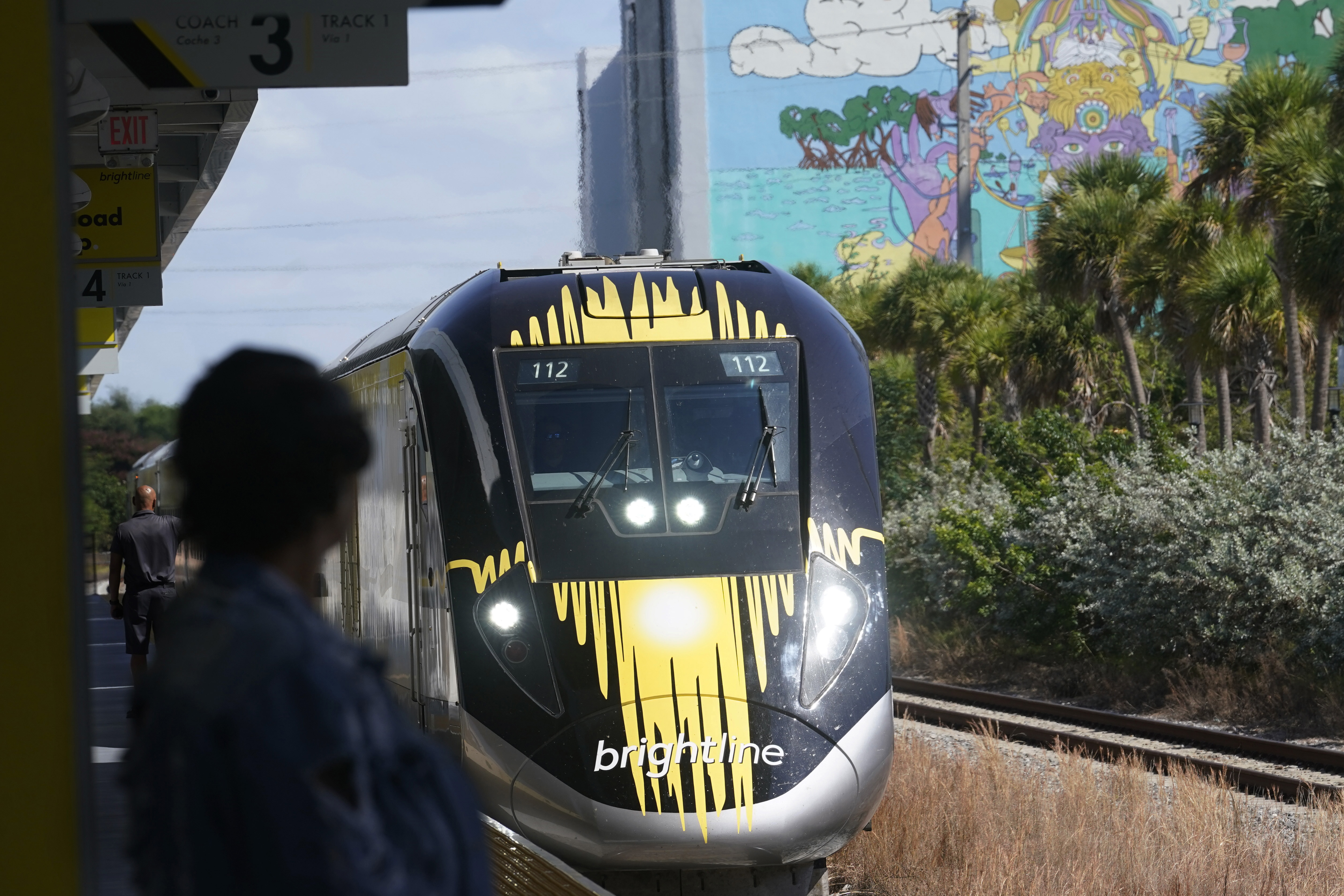 FILE - A Brightline train approaches the Fort Lauderdale station on Sept. 8, 2023, in Fort Lauderdale, Fla. A high-speed rail line between Las Vegas and the Los Angeles area is getting a Biden administration pledge of $3 billion to help start laying track. Nevada's two Democratic U.S. senators said Tuesday, Dec. 5, 2023 the $12 billion project led by Brightline West has all required right-of-way, environmental and labor approvals. (AP Photo/Marta Lavandier, file)