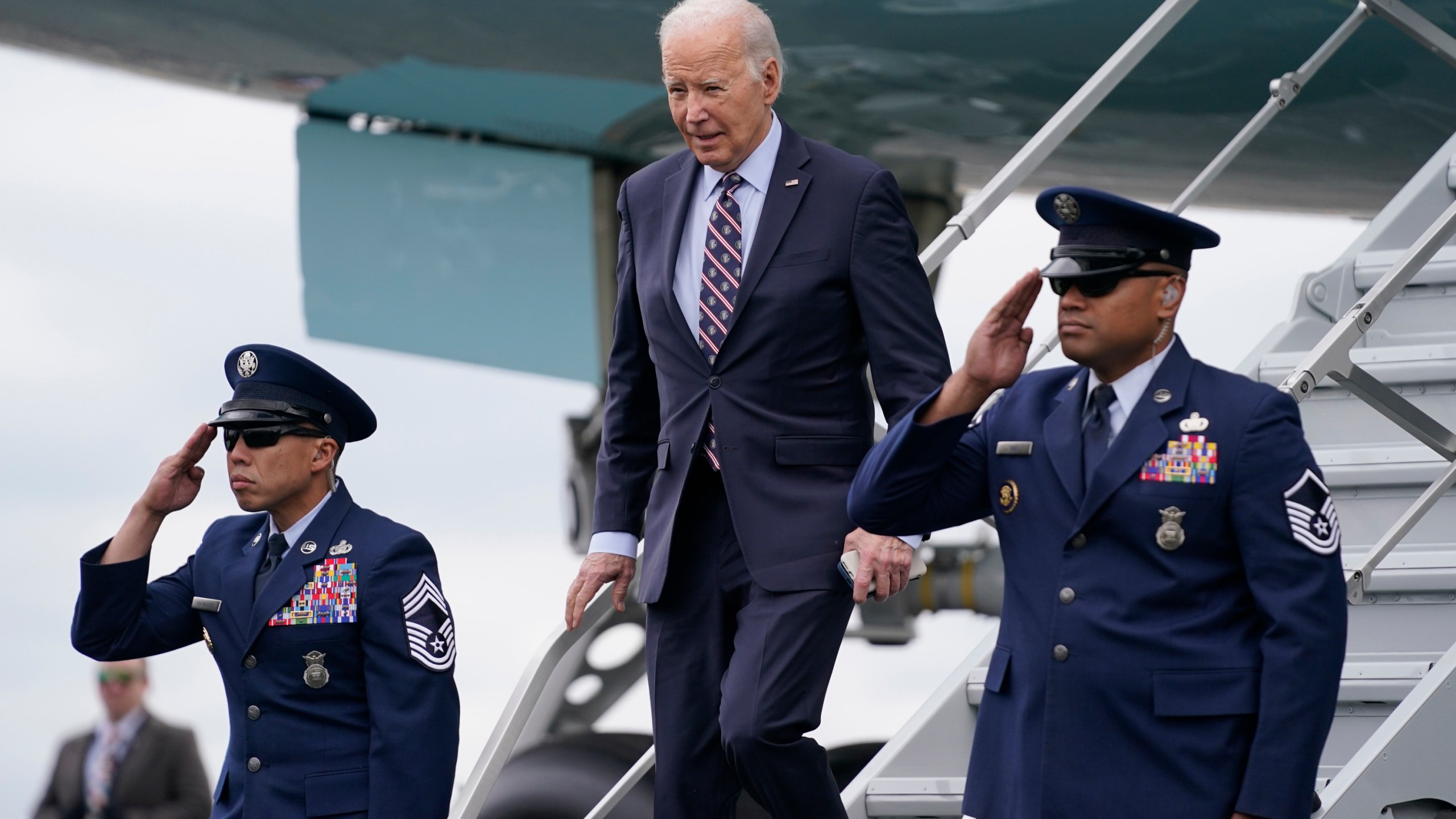 President Joe Biden arrives at Boston Logan International Airport to attend several campaign fundraisers, Tuesday, Dec. 5, 2023, in Boston. (AP Photo/Evan Vucci)