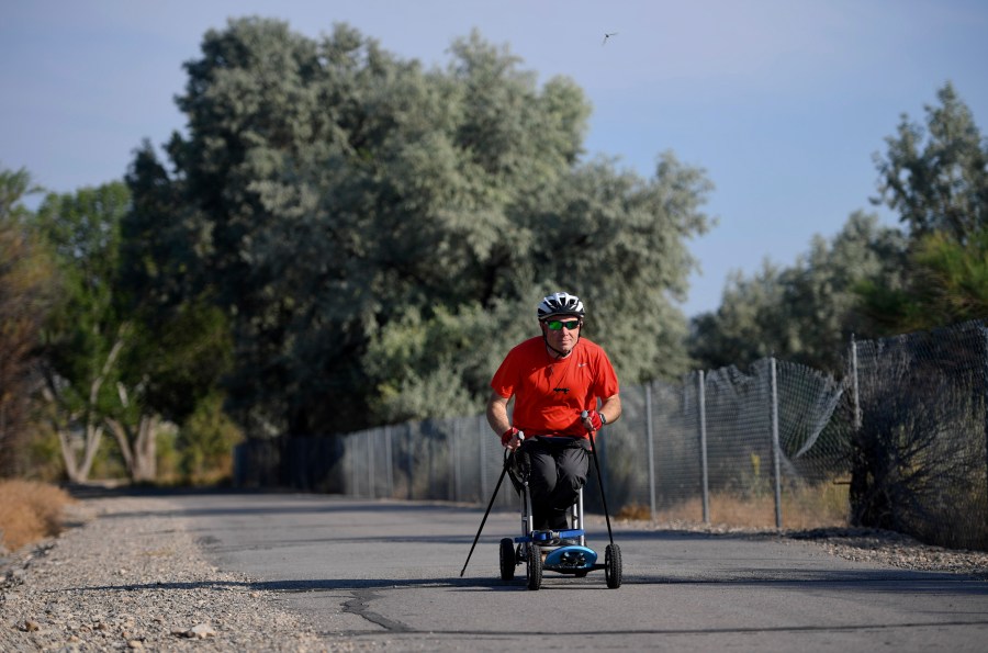 FILE - Kevin Hoyt rolls along as he exercises using a paraplegic-friendly mountainboard that was adapted for his use, July 8, 2017 along the Jordan River Parkway trail in Saratoga Springs, Utah. The U.S. Census Bureau wants to change how it asks people about disabilities, and some advocates are complaining that they were not consulted enough on what amounts to a major overhaul in how disabilities would be defined by the federal government. (Isaac Hale/The Daily Herald via AP, file)